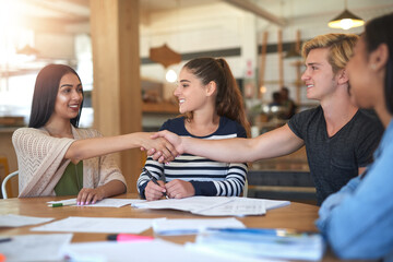 Happy people, handshake or students in cafe for meeting, studying together or diversity with smile. Welcome, college or friends in campus for greeting, teamwork or group collaboration for education