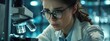 © Pavel - Female scientist working in the laboratory using a microscope, high quality