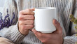 © Oleksiy - Man holding white mug indoors, closeup. Mockup for design