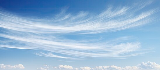 Aufkleber - Scenic view of wispy cirrus clouds creating a serene backdrop in the clear blue sky, ideal for a copy space image.