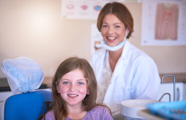 Dentist, kid and portrait with doctor for dental health or cavity treatment for oral hygiene or teeth cleaning. Pediatric, clinic and happy girl child with woman and smile for medical consultation