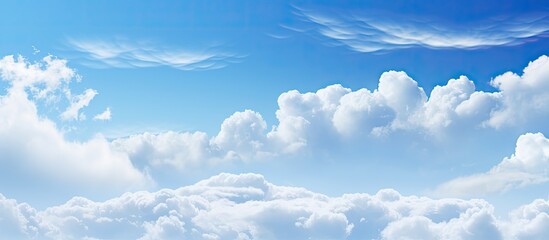 Aufkleber - White soft clouds floating gracefully in the clear blue sky, creating a serene backdrop suitable for a copy space image.