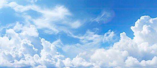 Aufkleber - Abstract style panorama with a backdrop of blue sky, white clouds, and copy space image.