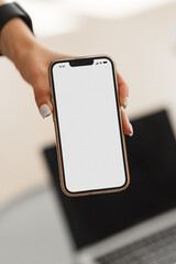 mock up phone in woman hand showing white screen