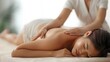 © LookChin AI - Asian Woman on Massage Table Receiving Therapeutic Back Massage in Quiet Professional Setting