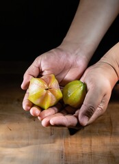 Wall Mural - hands with handful of star fruits