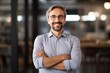 © alisaaa - Portrait of happy male entrepreneur with crossed arms