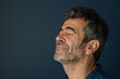 © MagnusCort - A close up of a man with beard and closed eyes looking to a side