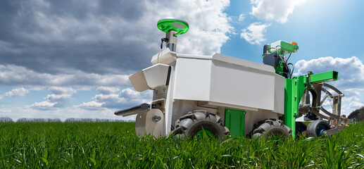 Aufkleber - Autonomous wheeled robot is working in an agricultural field. Using artificial intelligence on a smart farm..