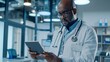 © Yaroslav Herhalo - Professional in white coat offers telemedicine services with advanced medical office technology.