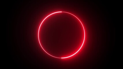 Round neon red frame against the black background of following .A circular neon frame made of  moving neon lights. Empty frame electric power round border glowing, burning flame sign.
