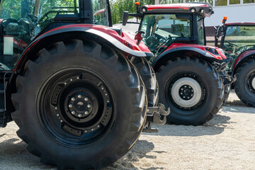 Wall Mural - Row of red agricultural tractors for sale.