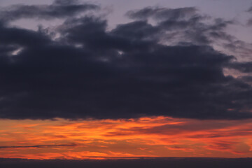 Wall Mural - Dramatic epic sunrise, sunset red orange storm sky with clouds background texture