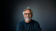 © ML - A handsome senior (mature) man with gray hair smiles at the camera. Happy and confident