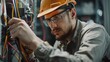 © Bijac - focused electrical engineer testing wiring installations with a multimeter skilled technician at work