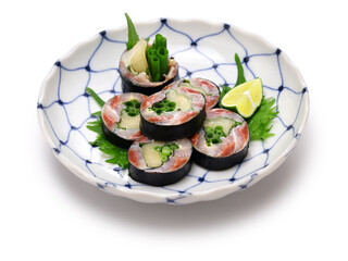 Wall Mural - A Japanese sushi restaurant roll dish of pickled sardines and ginger wrapped in nori seaweed.