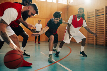 Wall Mural - Professional basketball team dribbling the ball and training defense and attack