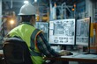 © Maxim Borbut - In a production control center, Industrial Engineers observe monitoring screens. Concept of technology.