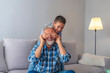 © Dragana Gordic - Senior grandfather with a small grandson at home. Positive grandson covering eyes of his relative.  Boy is covering grandpa's eye making a surprise. Portrait of handsome grandpa and grandson