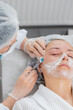 © Andrii Iemelianenko - Beauty anti-aging injections biorevitalization face mesotherapy. Cosmetologist doctor making needle hyaluronic injections syringe into skin of young woman girl. Lifting procedure therapy in clinic