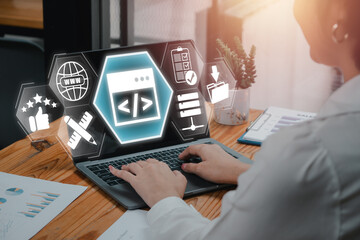 Wall Mural - web design concept, businesswoman using laptop computer on desk with web design icon on virtual scre