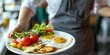 © Brian - waitress holding breakfast plate in a cafe or restaurant