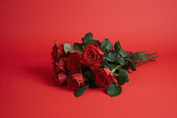 Sticker - AI generated illustration of red roses on a red surface