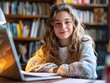 © Thares2020 - Smiling Young Female Student Studying and Learning Virtually with Laptop in Library Workspace