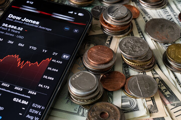 Wall Mural - Various coins and the smartphone on various banknotes