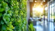 © Mikus - A tight shot of a green office wall, adorned with side-growing plants In the picture's depth, a table lies within the room background