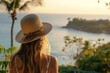 © GoodandEvil - Woman gazing at a coastal view