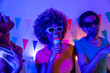 © unai - Cool afro woman singing karaoke with friends at home