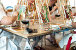 © Alfonso Soler - Sip and Paint Event. Art class with friends enjoying painting and wine