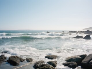 Sticker - Tranquil Rocky Coastal Waves on a Clear Day