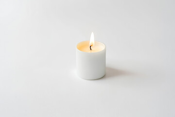 Sticker - Close-Up of a Lit White Candle on a White Background