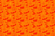 © Westend61 - Pattern of rows of orange Halloween icons
