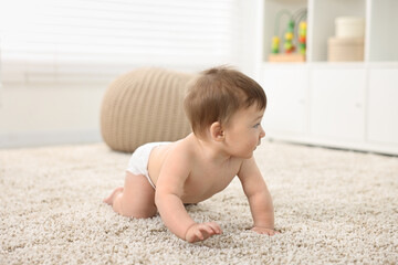 Canvas Print - Cute baby boy crawling on carpet at home