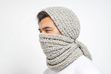 Poster - Man wearing a grey knitted scarf covering his face