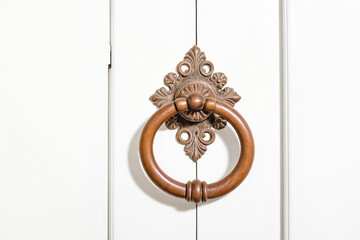 Wall Mural - Ornate Wooden Door Knocker on White Door