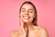 © Valerii Apetroaiei - Portrait of a young woman with radiant skin and natural beauty on a pink background