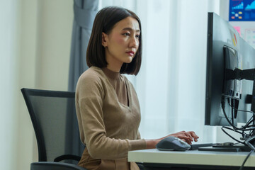 Wall Mural - asian prompt engineer develop coding app with software data sitting in front of computer monitor at 