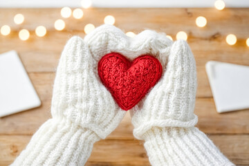 Poster - Warm Hands Holding a Knitted Red Heart