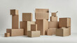 © Oranuch - Neatly arranged stack of brown cardboard boxes of different sizes on a clean white background