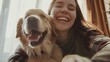 © Vladyslav  Andrukhiv - Fun together. A happy woman is taking a selfie with her cheerful pet, who has a funny expression on his face
