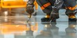 © Anastasiia - Worker applying gray epoxy resin to fresh floor for finishing touch. Concept Epoxy Resin Application, Industrial Flooring, Construction Worker, Finish Touch, Gray Color