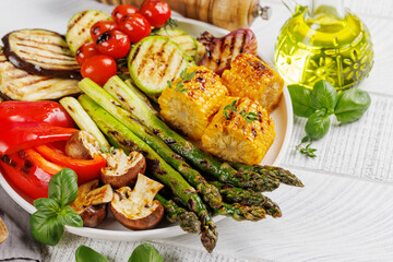 Wall Mural - Assorted grilled vegetables on a plate, showcasing a colorful meal