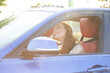 © pathdoc - Happy woman driving her new car