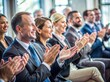 © Evarelle - A group of business professionals applauding at a conference or meeting, perfect for corporate event promotions or business articles.