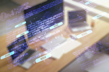 Wall Mural - double exposure of abstract programming language with world map and modern desktop with laptop on ba