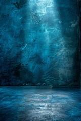 A dimly lit room with textured blue and gray walls and a concrete floor, creating a mysterious and moody atmosphere.